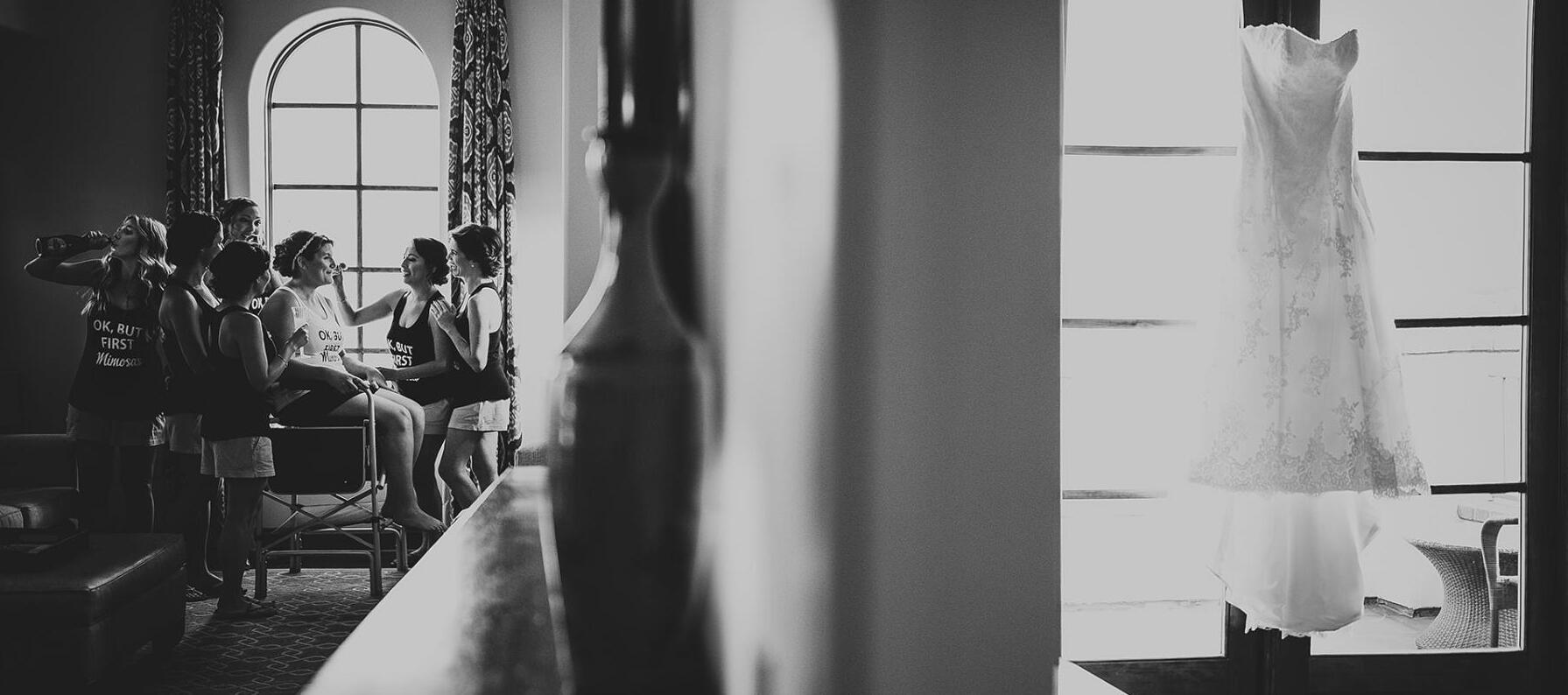 bridesmaids helping bride get ready