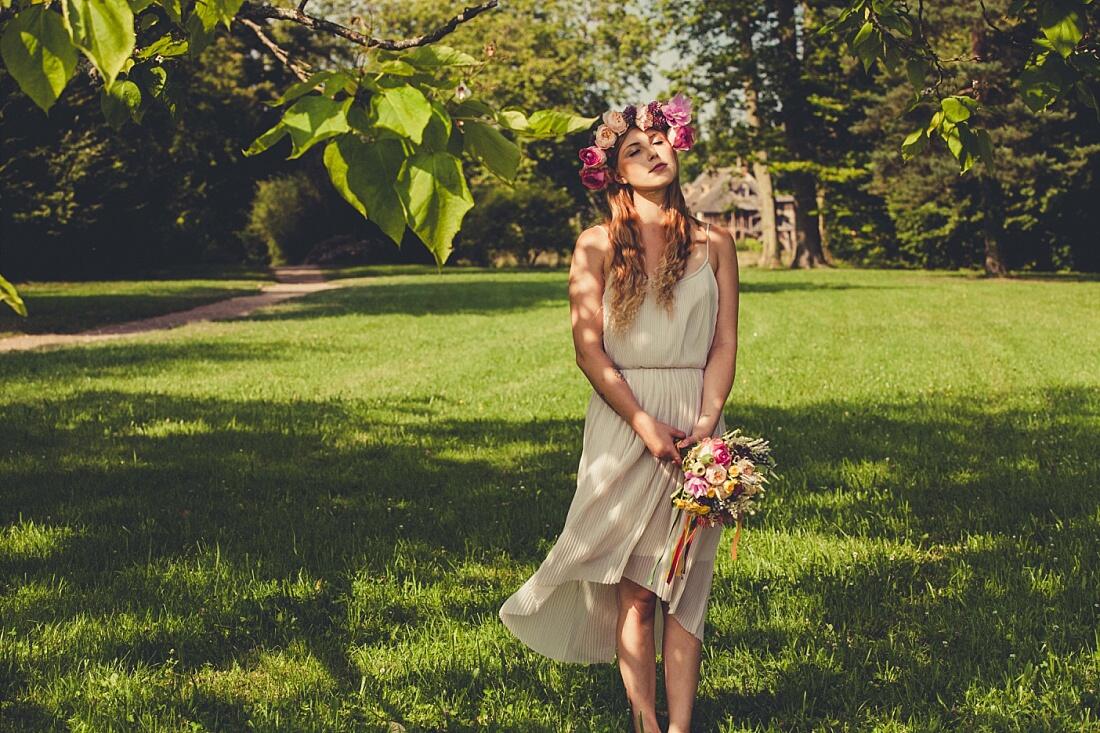 bride looking into sun with eyes closed