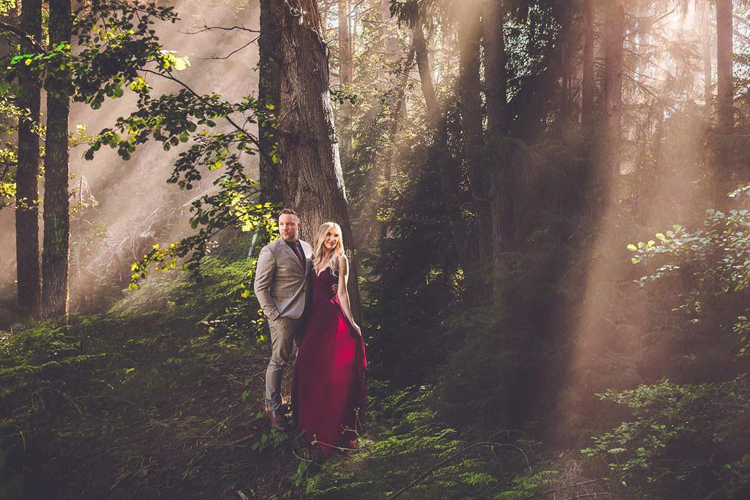 Beautiful engagement photography in a green forest.