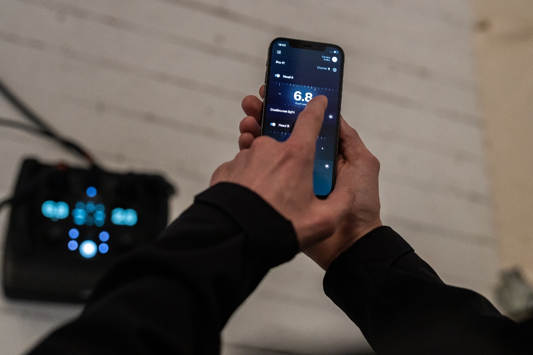 Close up of a person's hand using a phone for photography