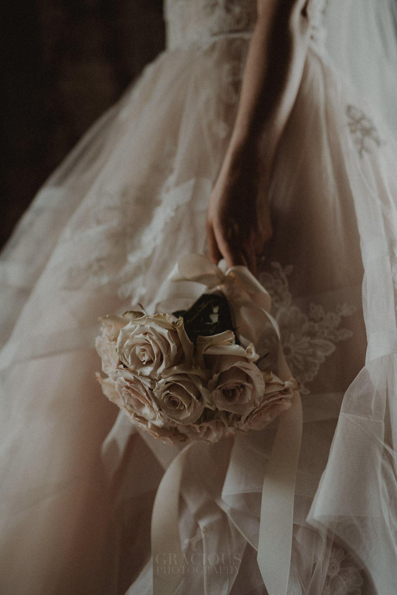 an image of a bride holding a wedding bouquet