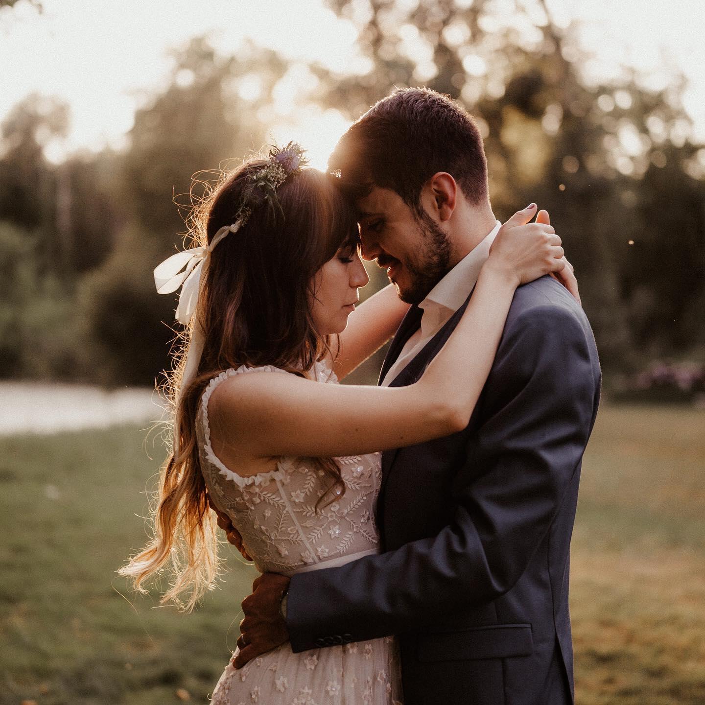 A couple leaning forehead to forehead for their engagement photo shoot.