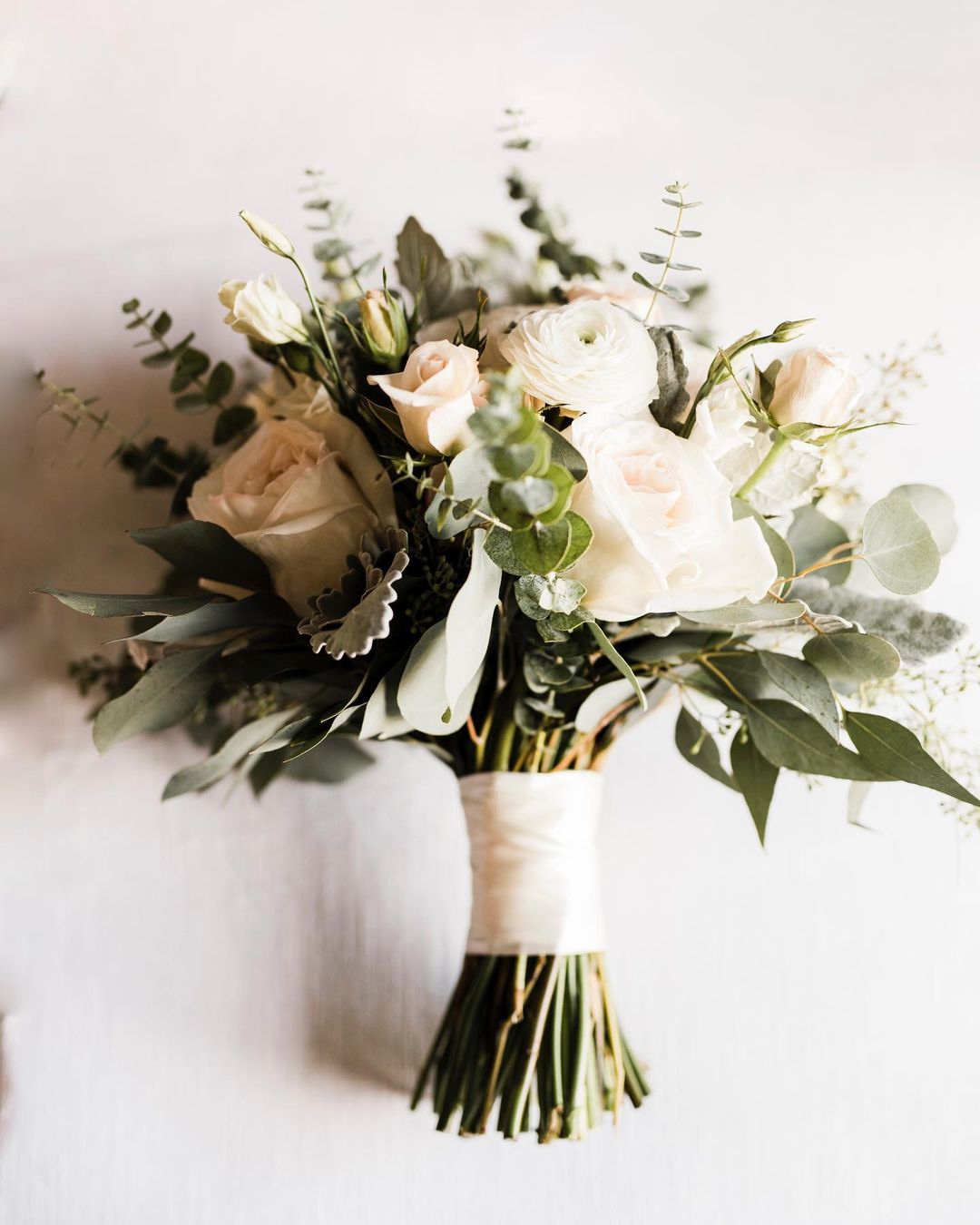 A close up shot of a bridal bouquet placed on a table