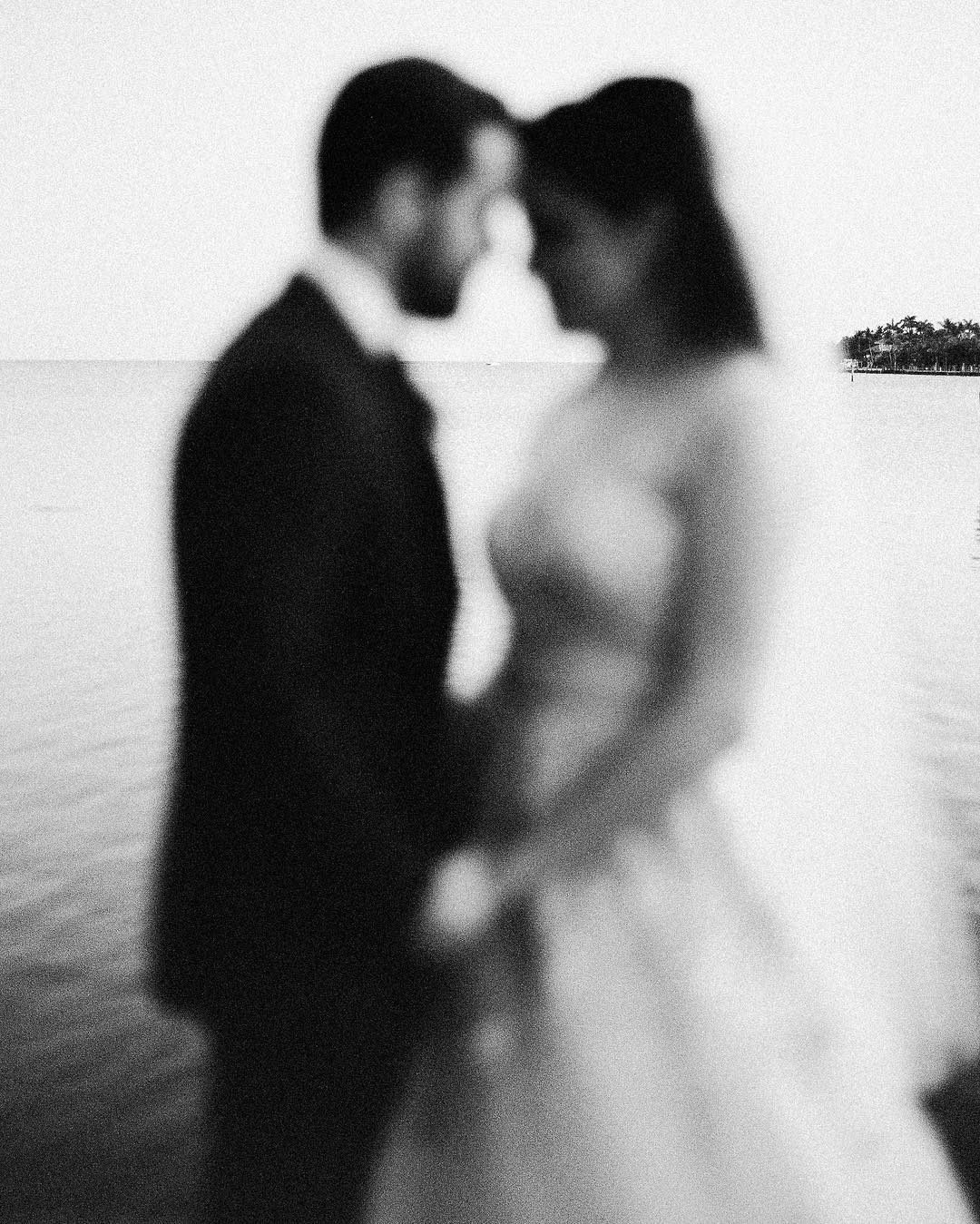 an artistic grainy off focus image of a wedding couple