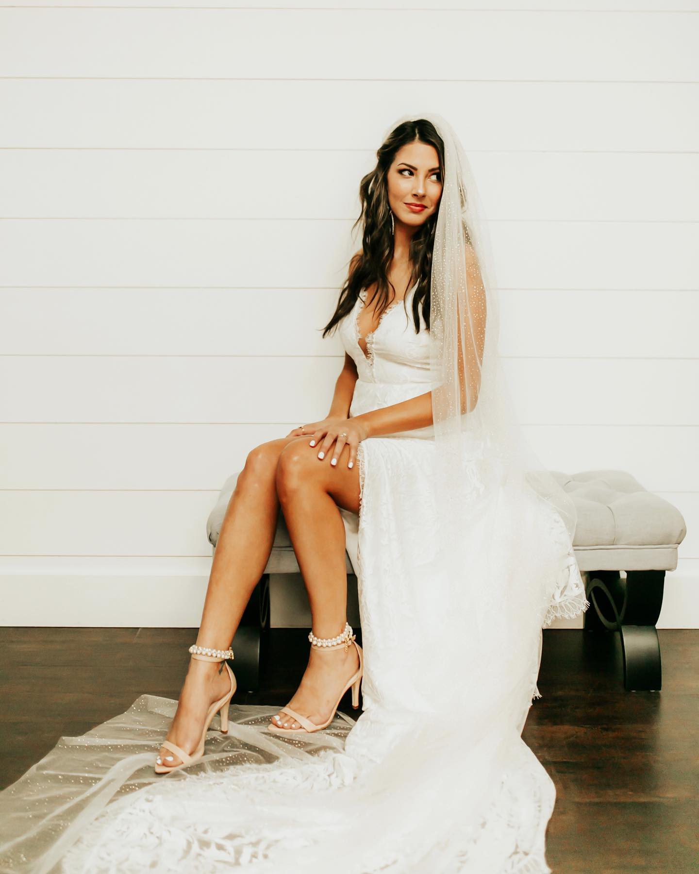 A portrait of a bride sitting on a desk