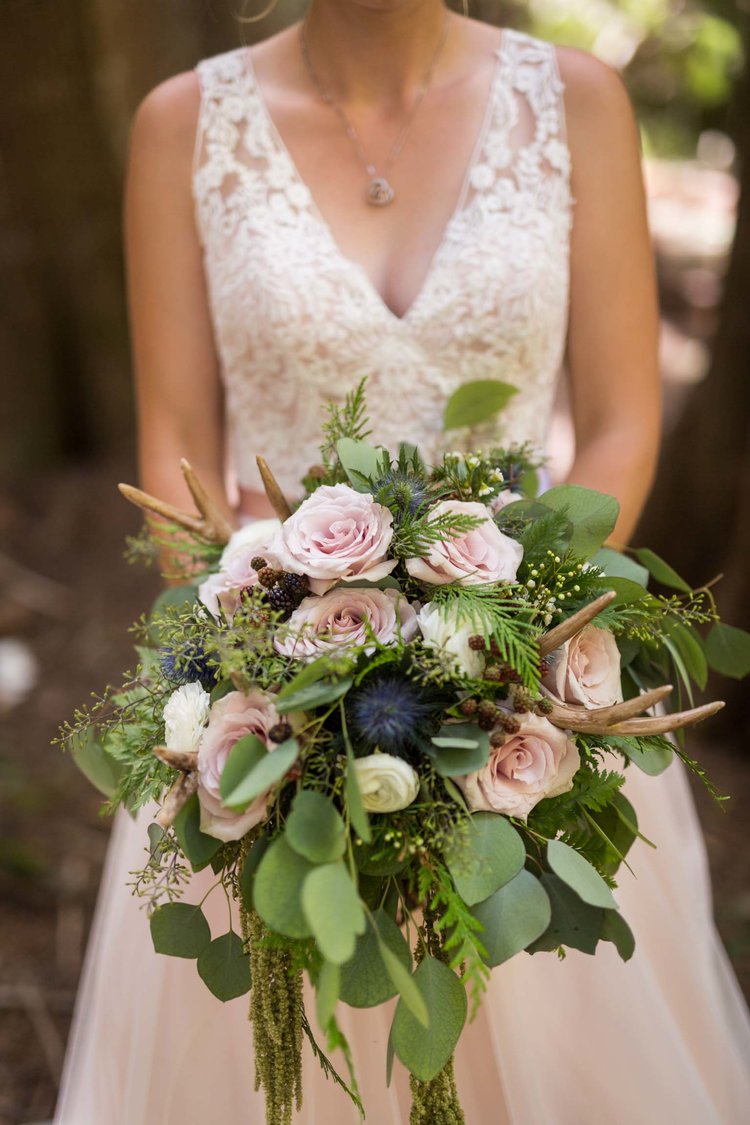 A detailed shot of a bride holding her bridal bouquet