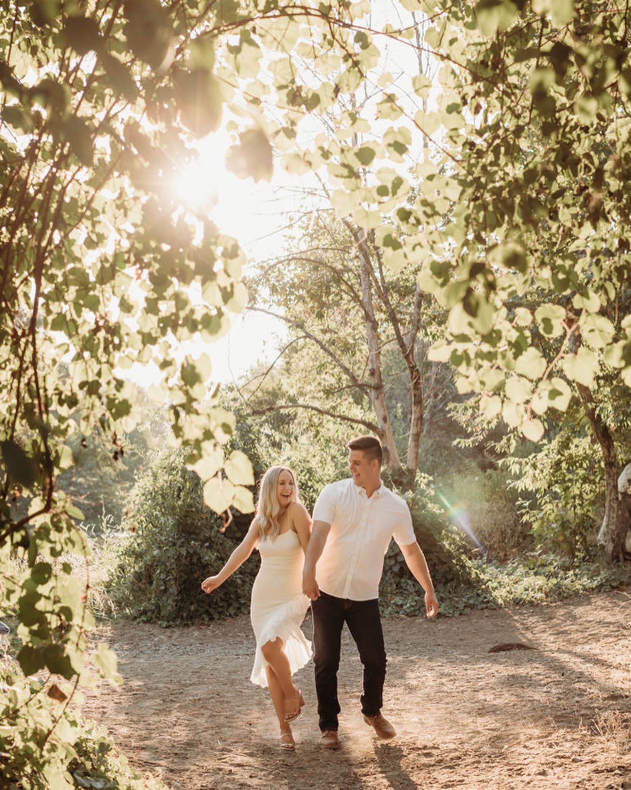 A couple posing for a dance move in the middle of a jungle