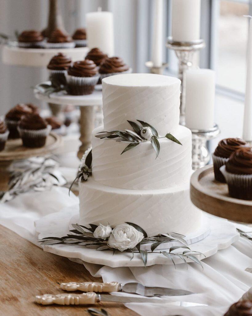 a detail shot of a white wedding cake