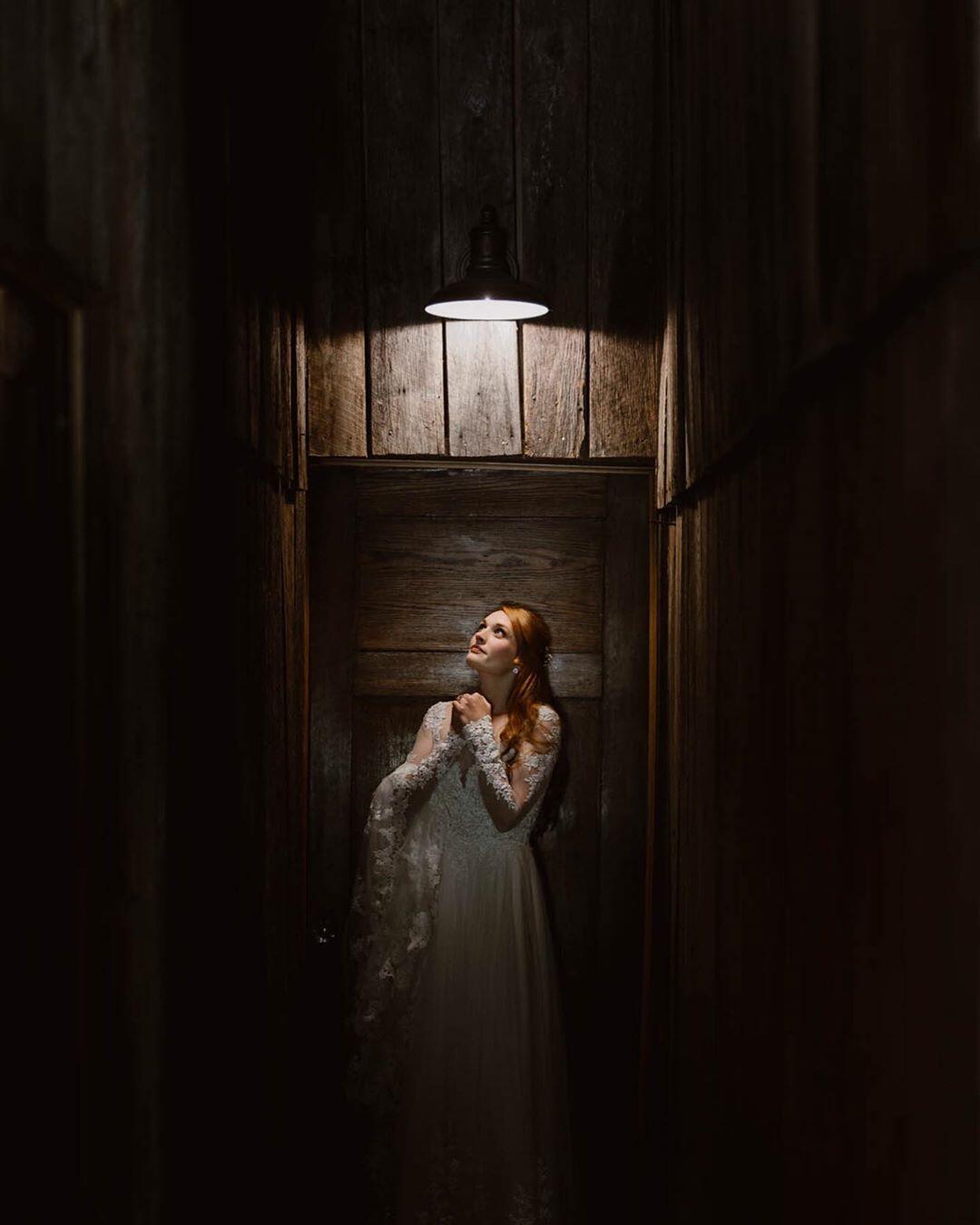 bride looking up at overhead light