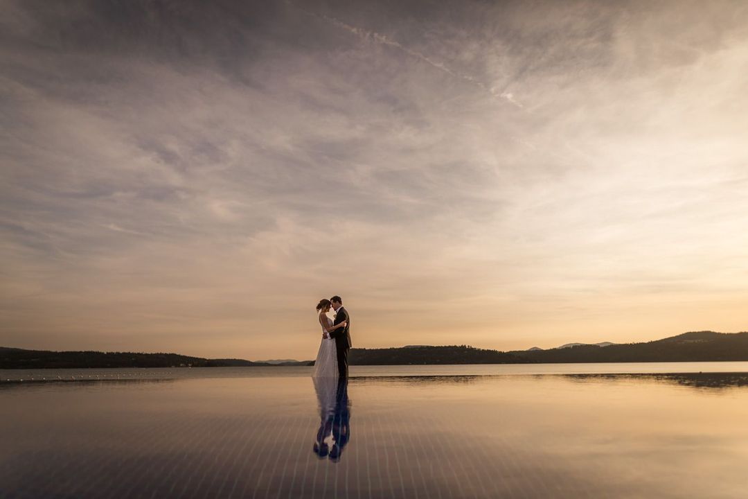 a couple sharing a close moment in front of a beautiful landscape