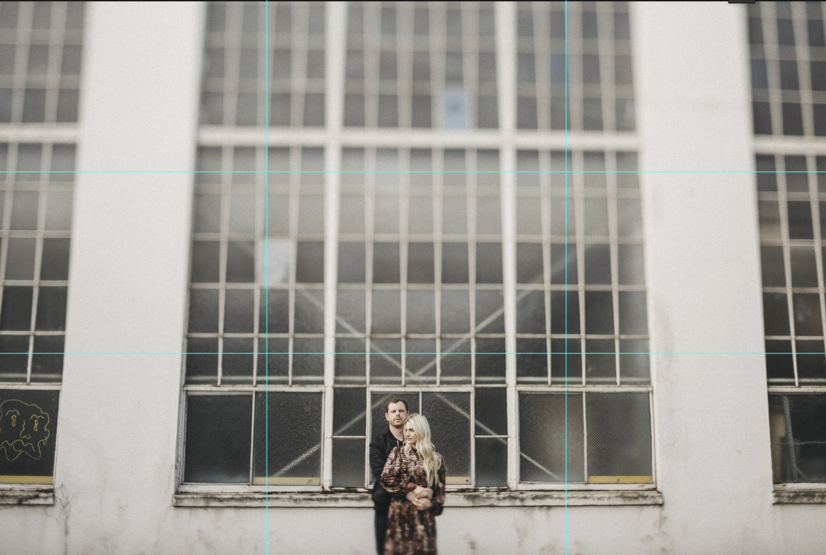 A 3 by 3 camera grid is visible on the image where a couple holds each other while standing in front of a wall