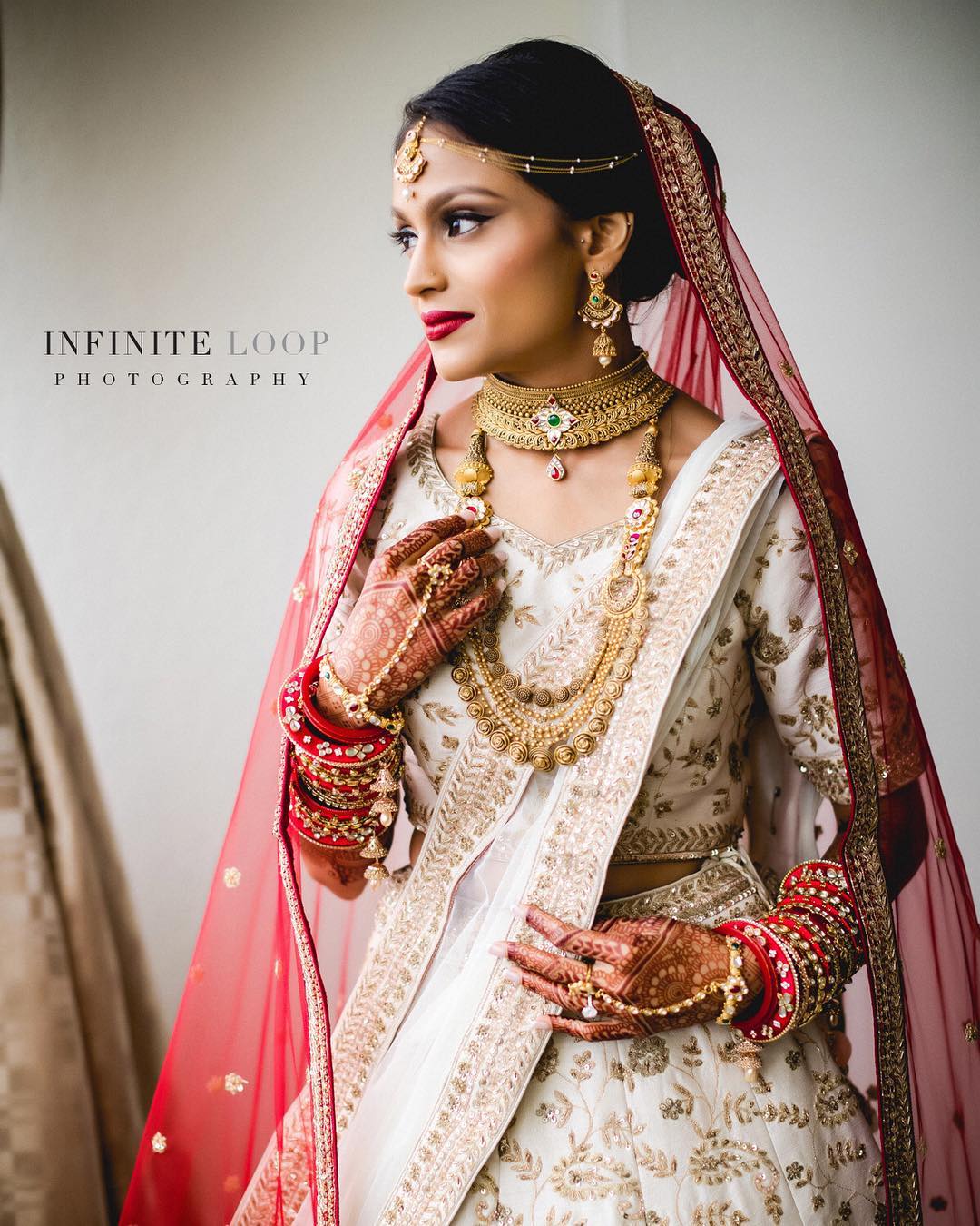 Mid close up of a bride wearing an Indian traditional dress