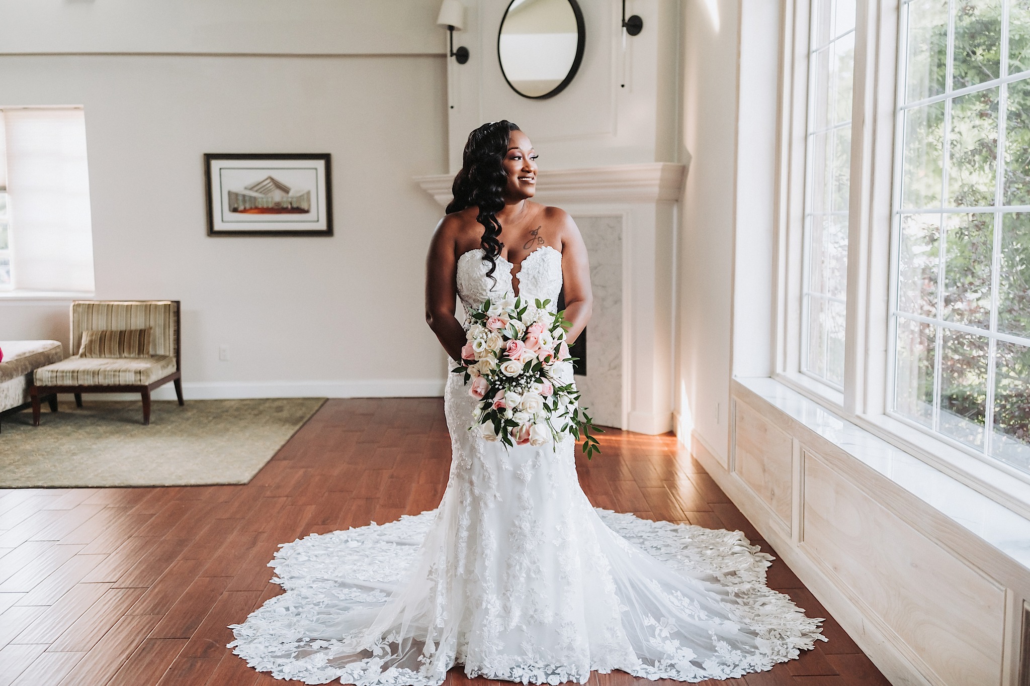 a bride posing in her bridal attire holding the wedding bouquet (a shot captured by John Branch IV Photography) 