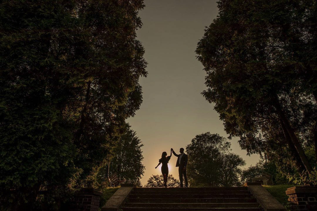 a sunset silhouette of a couple dancing 