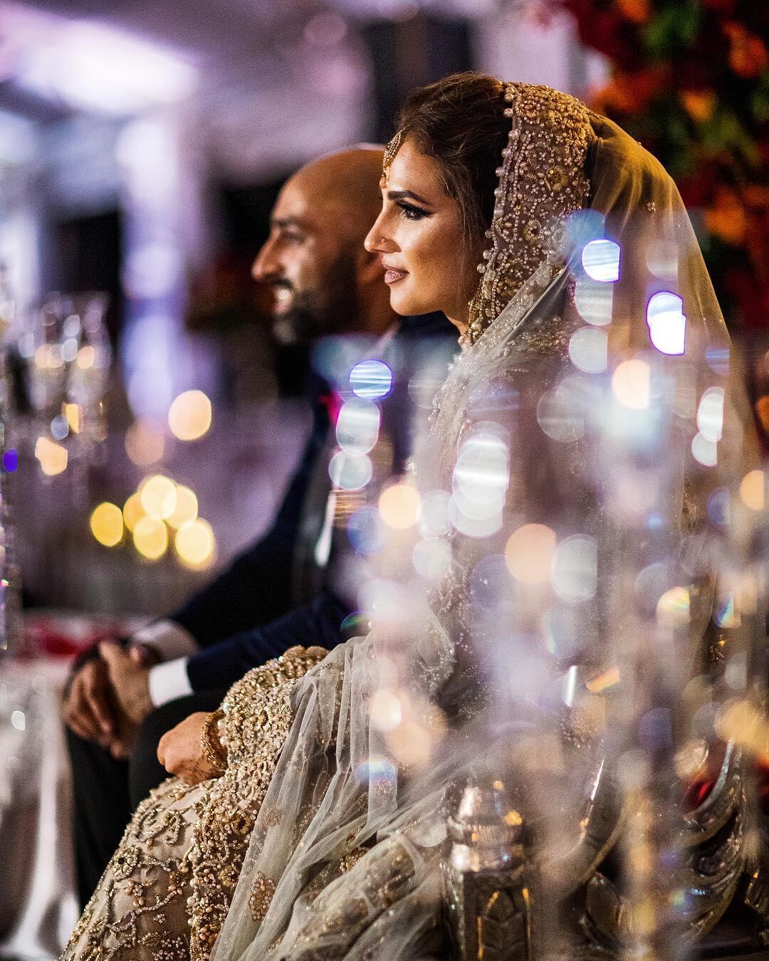 couple sitting at wedding reception