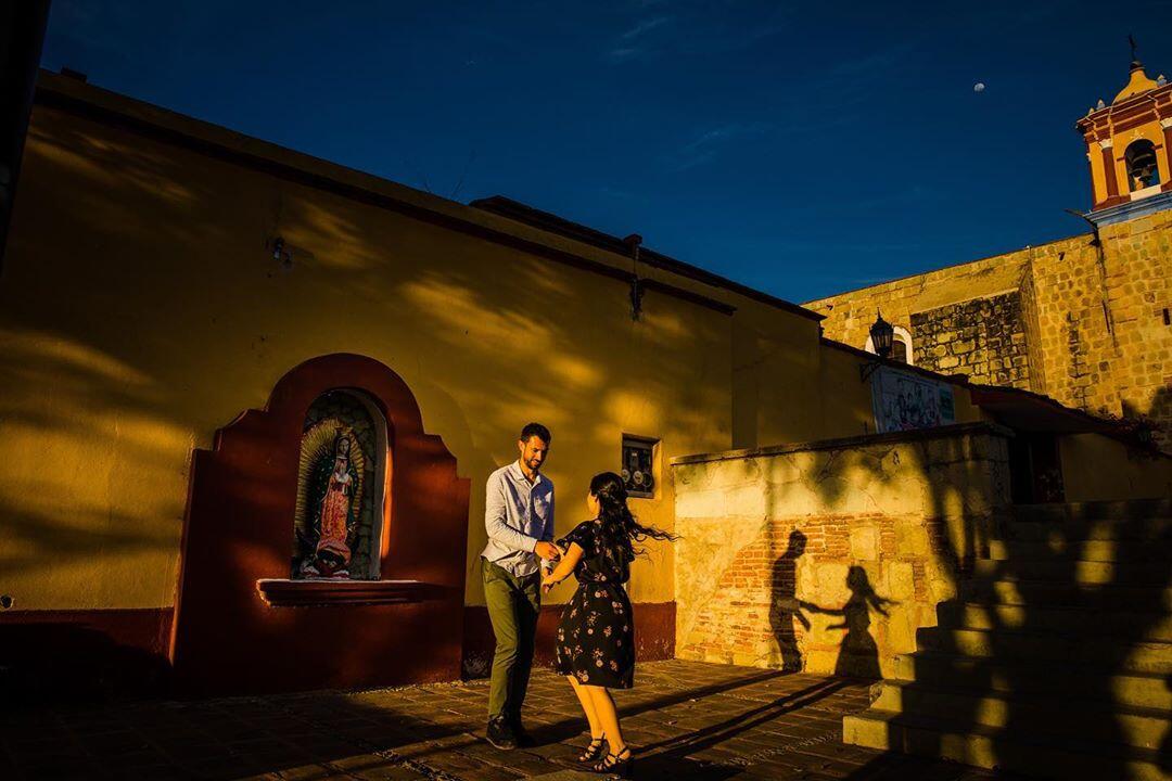 couple slow dancing in middle of street