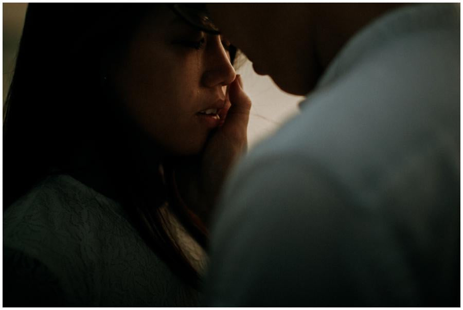 An emotional close-up shot of the bride and groom depicting going against the grain in wedding photography