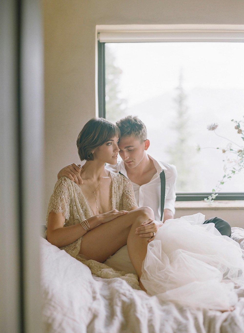 A couple posing in a dreamlike room setting