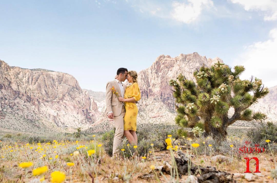 A couple posing in an outdoor setting during an engagement session 