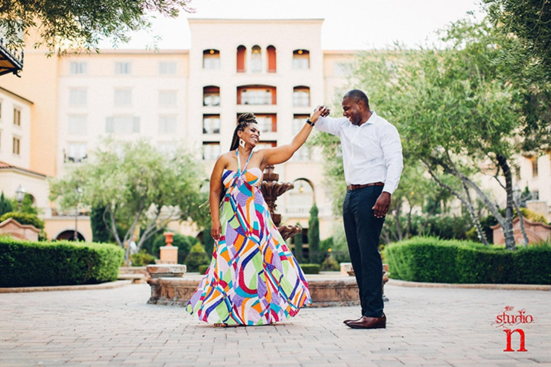 A couple of color posing for an engagement session photographed by husband and wife photographers