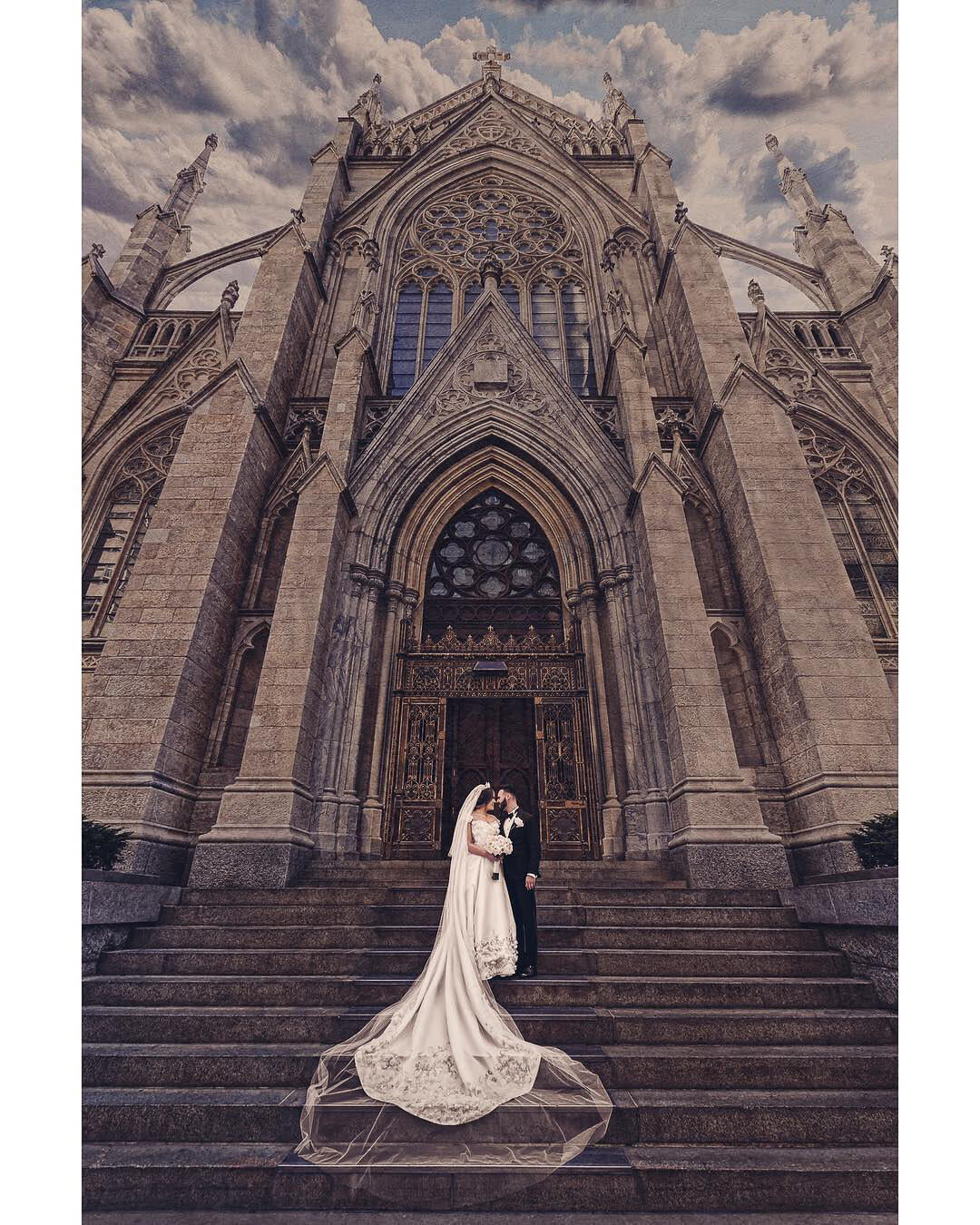 A gorgeous bride & groom wedding photoshoot standing outside the Church