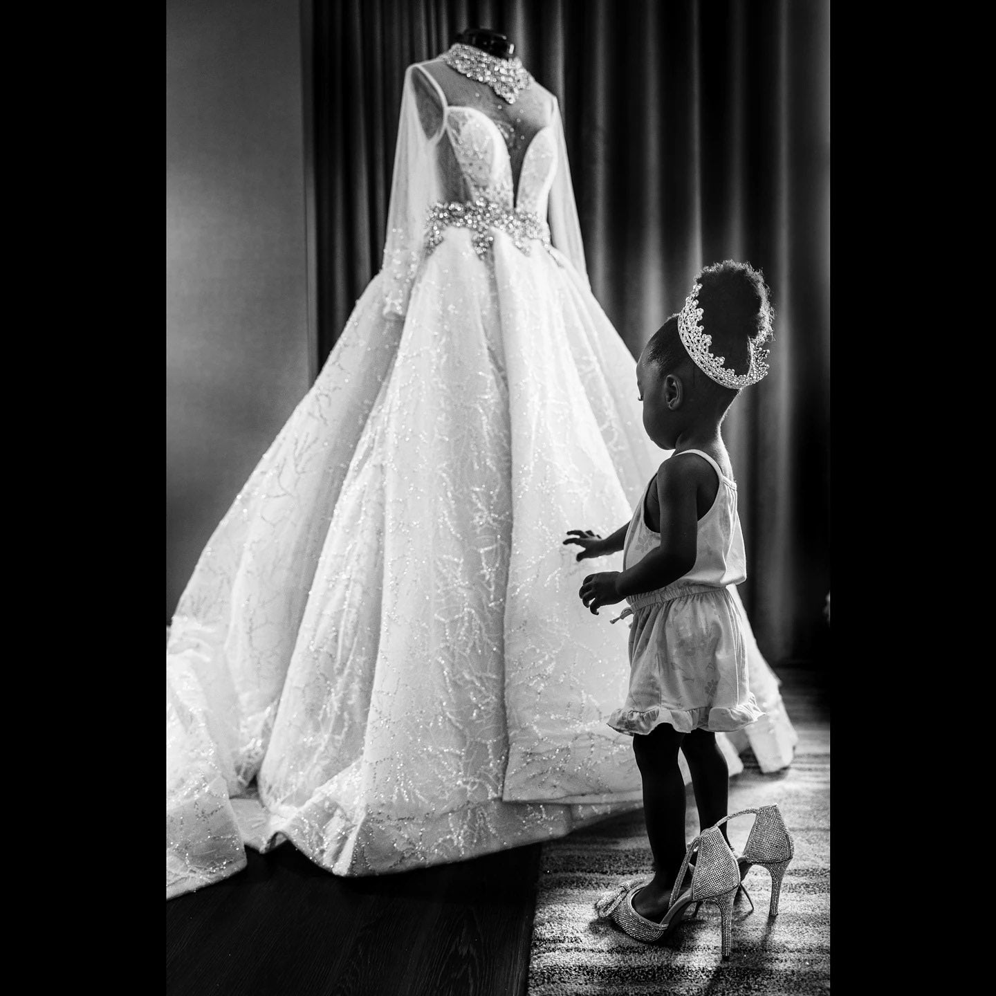 a kid looking at a wedding dress 