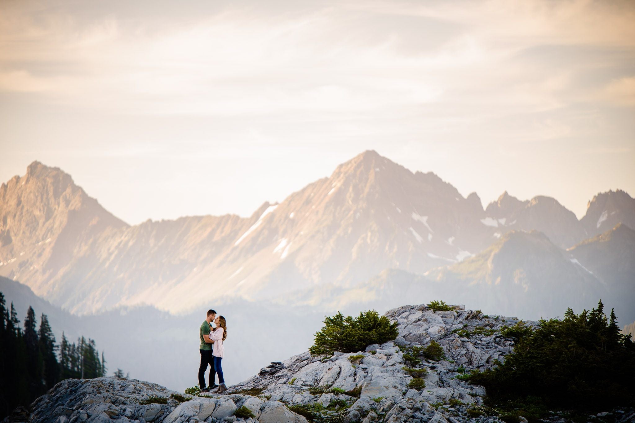 Couples posing on top of a cliff - one of the captures by Joe and Darryl Ann (a husband and wife team) of Salt and Pine Photo