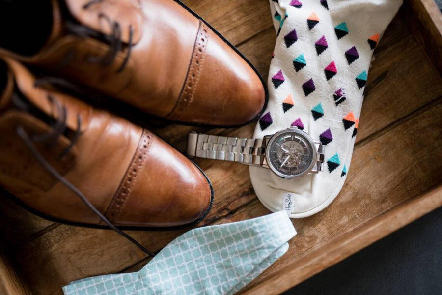 Groom’s shoes, socks, watch, and bow tie