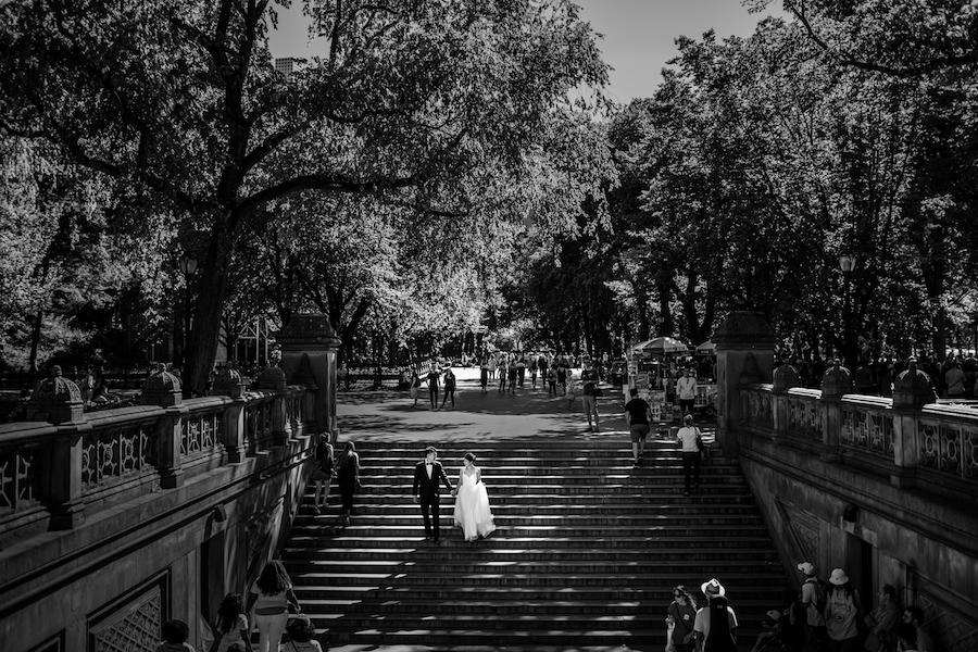 couple walking down the stairs black and white photo