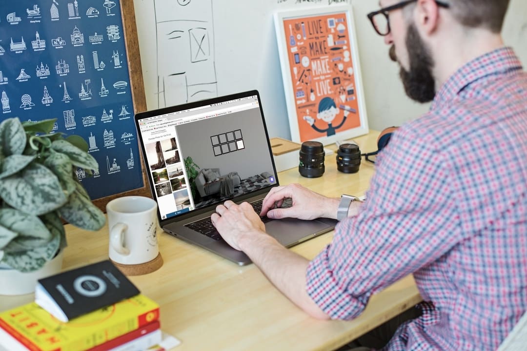 A side-angle shot of a person working on the Swift Galleries wall art templates