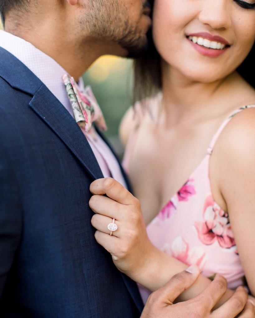 a close up of a groom kissing the bride on the cheek