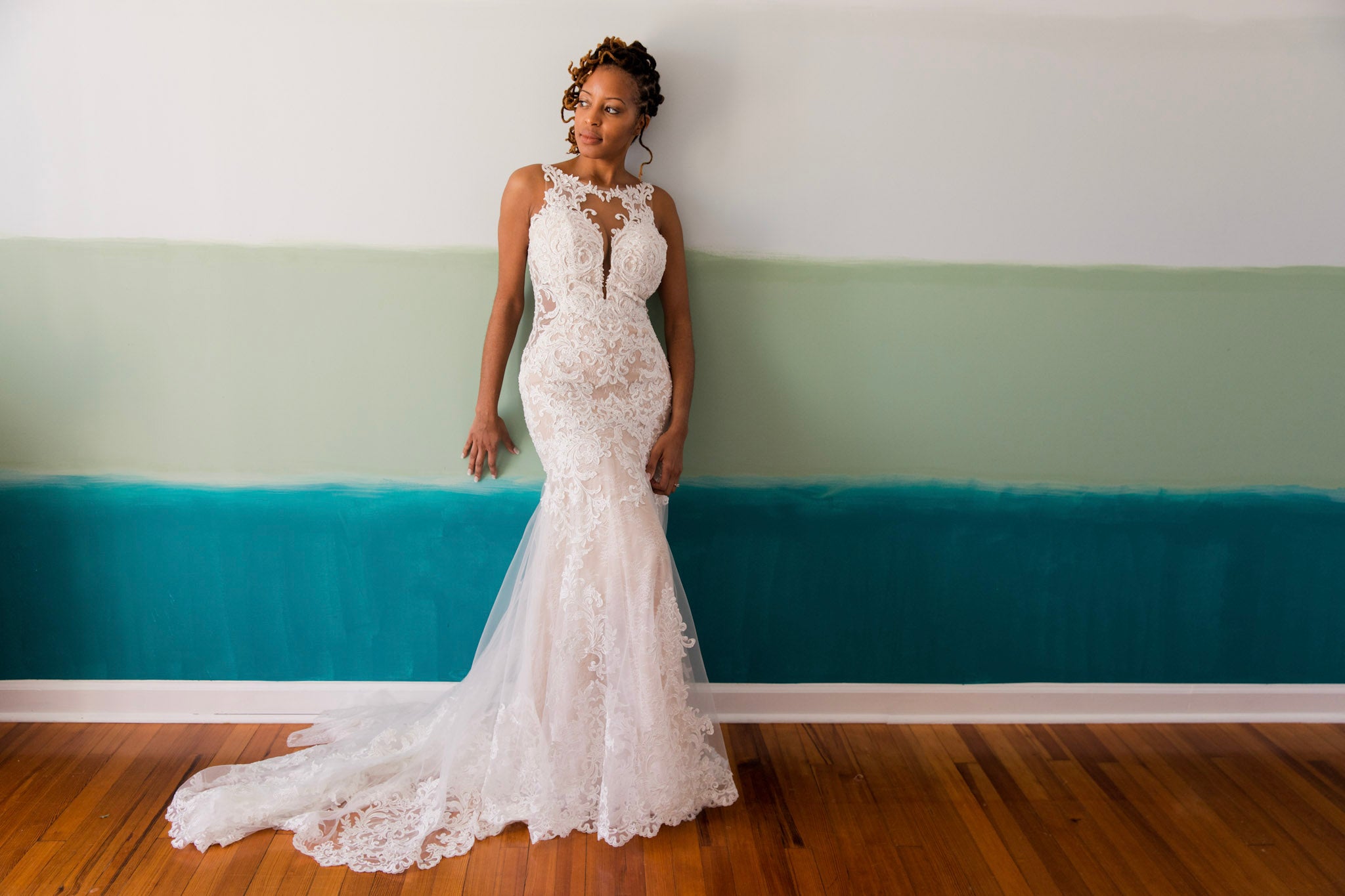 a wedding bride posing in her wedding attire from the front