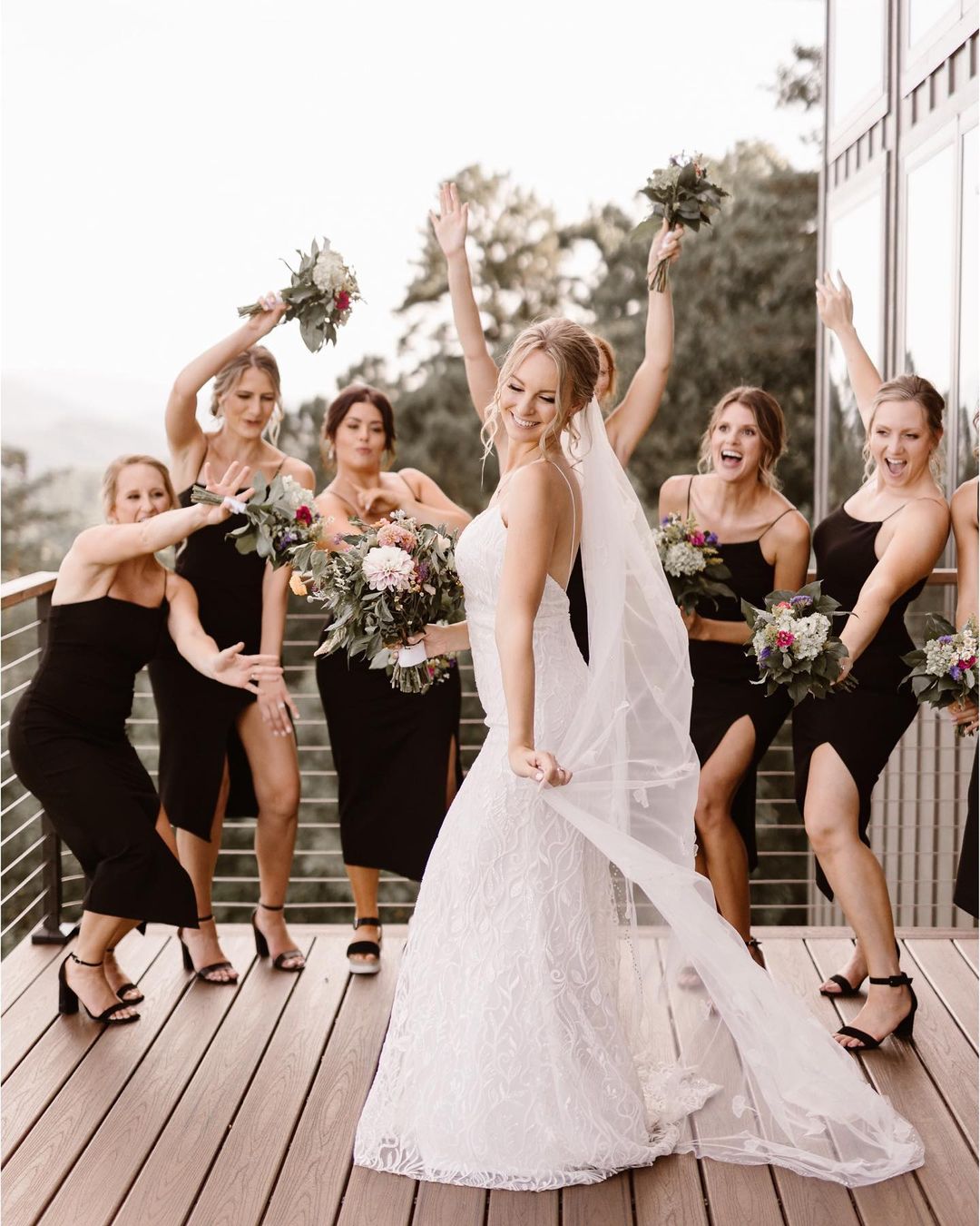 the bridesmaids cheering off the bride in her wedding dress