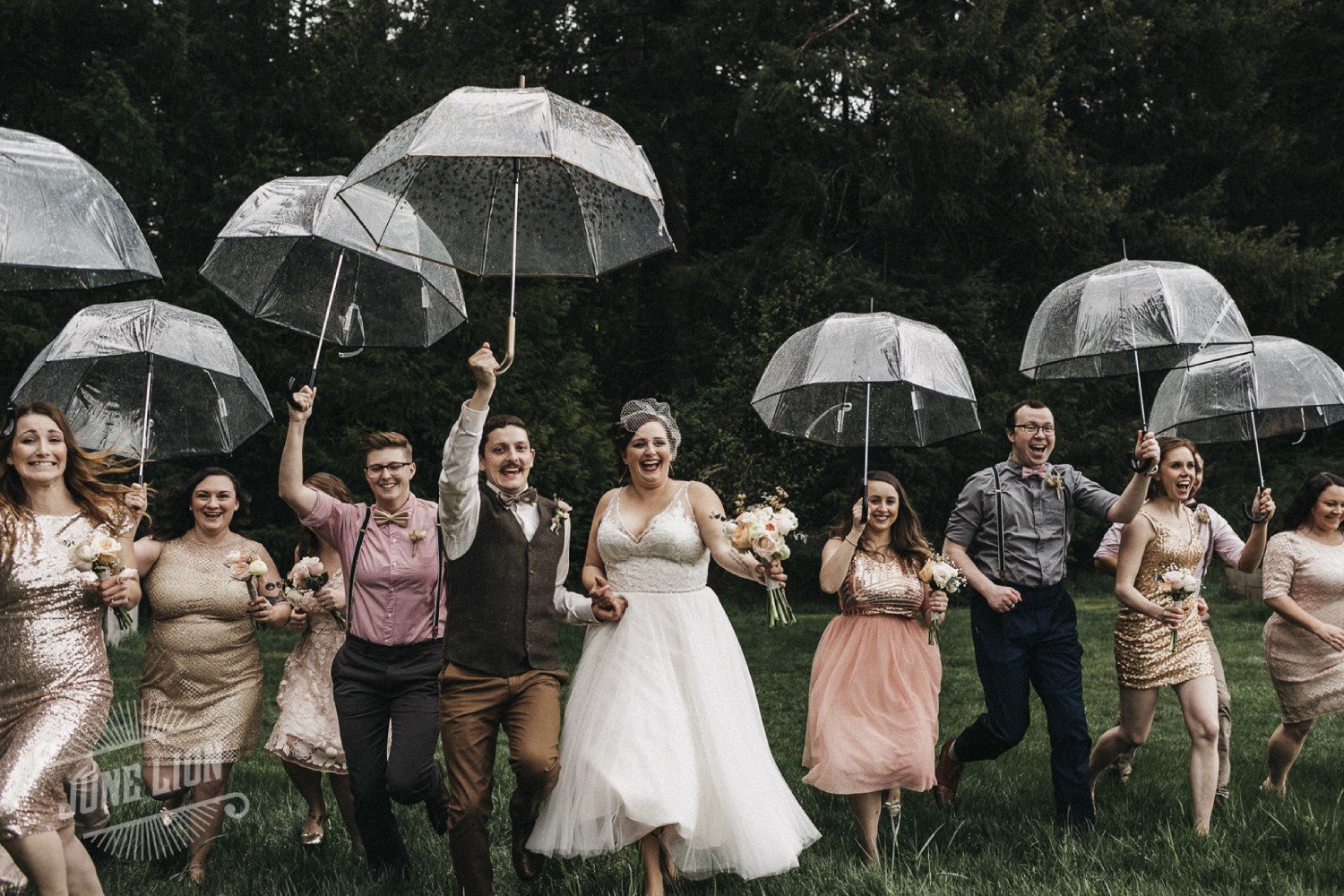 a wedding couple slowly running with their bridesmaids and groomsmen