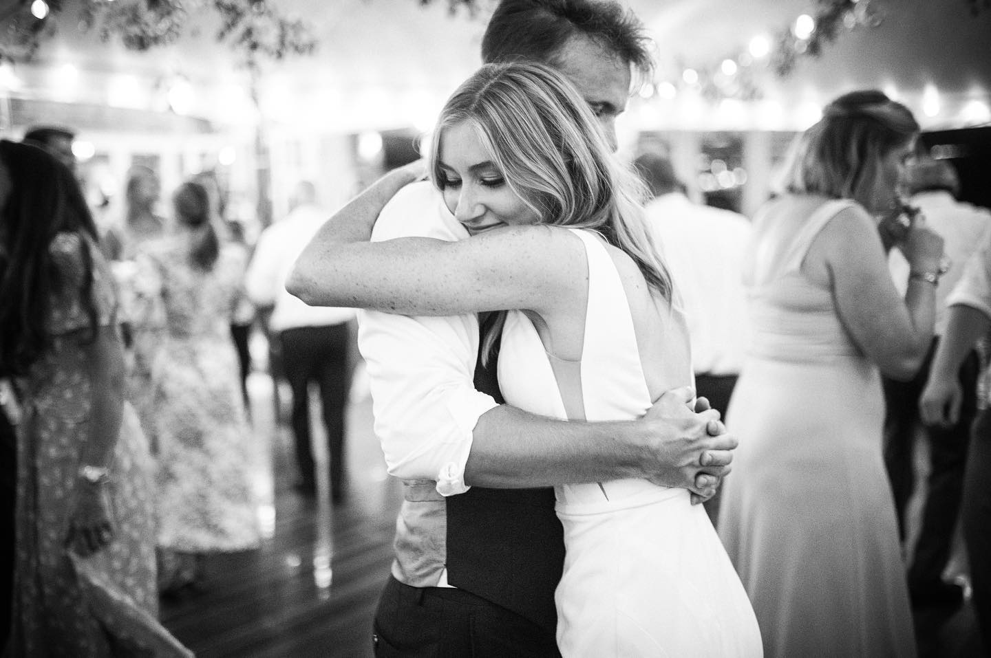 a wedding couple hugging each other