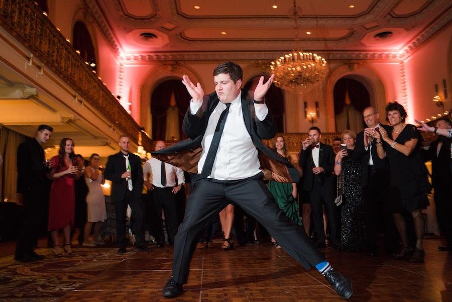 A man dancing at wedding reception