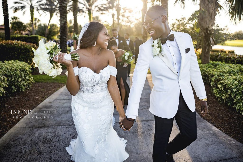 a wedding couple followed by the wedding party exiting the wedding ceremony