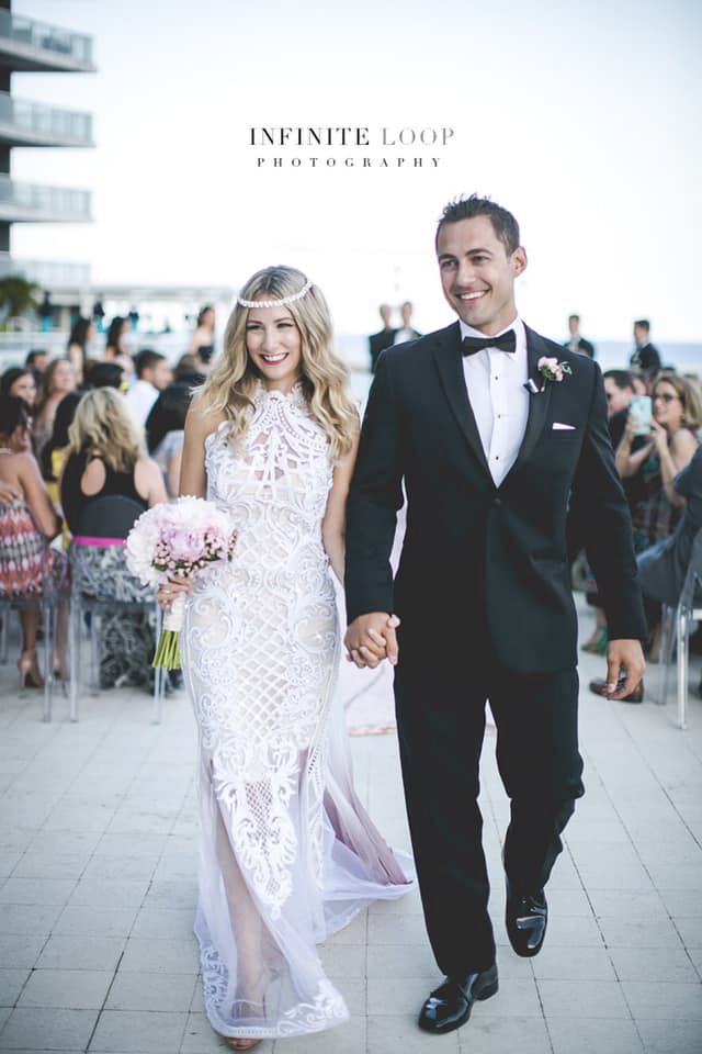 a wedding couple exiting the wedding venue after the ceremony