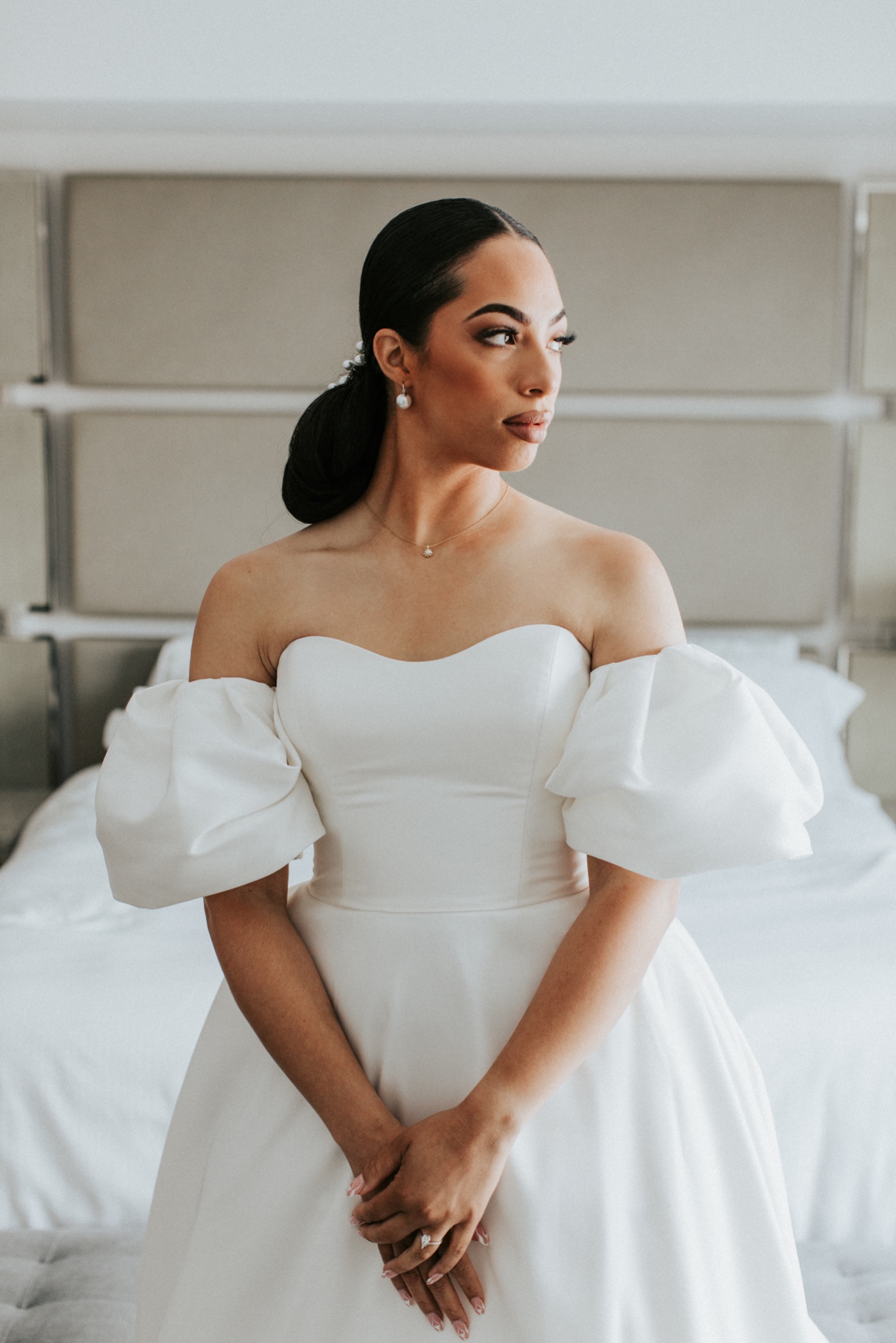 a wedding bride posing in her wedding dress